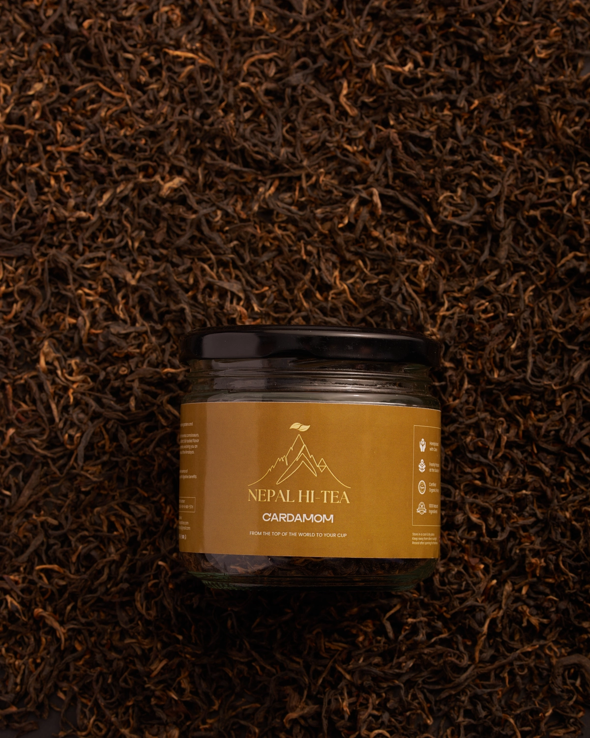 Nepal Hi Tea cardamom flavoured placed among other dried tea leaves.